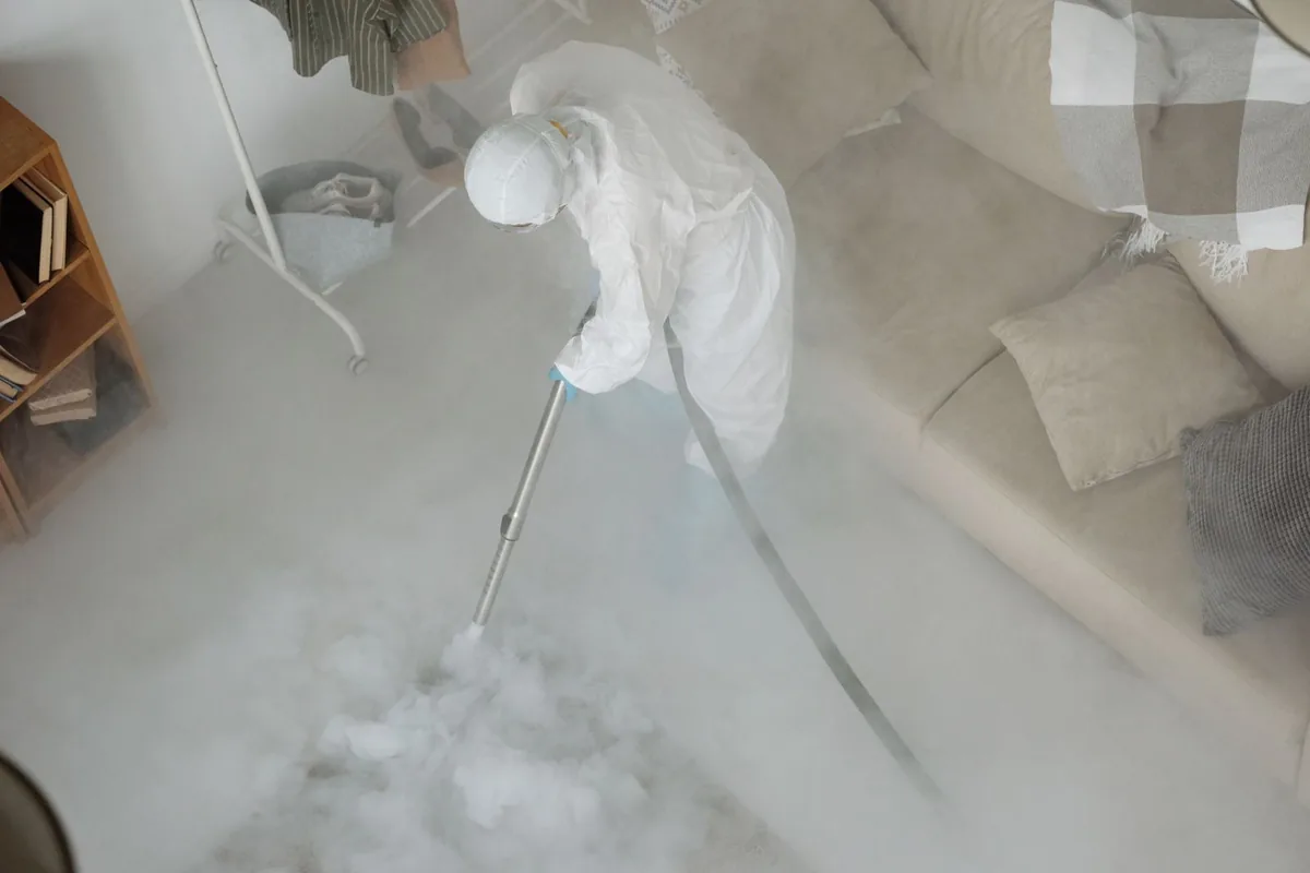 Biohazard cleanup technician in protective equipment, Taft Mosswood, CA